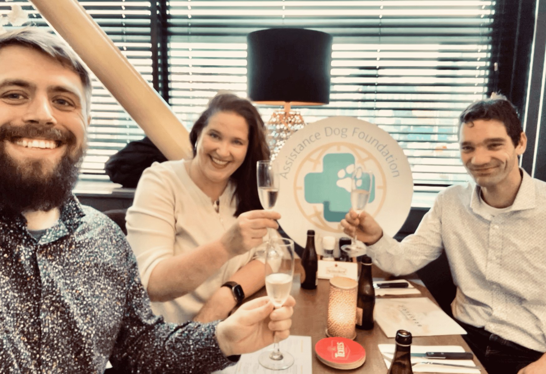 Three founders of Assistance Dog Foundation celebrating on the day of incorporation.